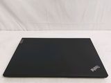 a black laptop sitting on a white surface