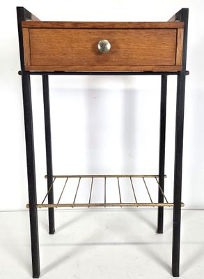 a small wooden table with a metal shelf underneath it