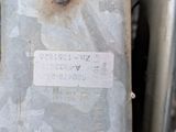 a close up of a piece of metal with a tag on it