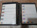 a black binder with a lot of stamps on it