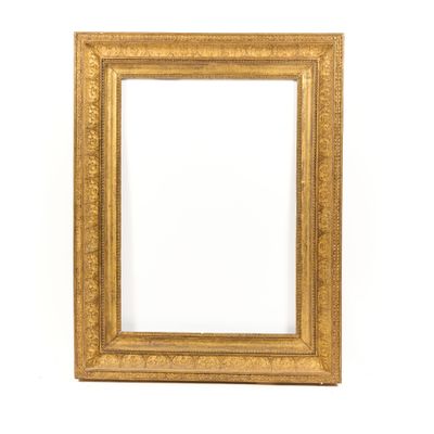 a gold frame with a white background and a white wall