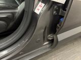 a close up of a car door handle with a sticker on it