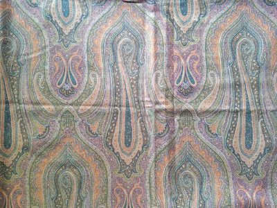 an image of a colorful paisley print fabric with a black background