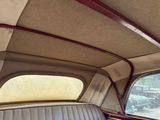 a view of the inside of a car from the driver ' s seat