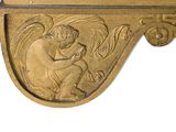 a gold plaque with an angel on it on a white background