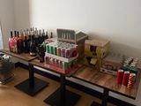 a table that has a lot of bottles and cans on it