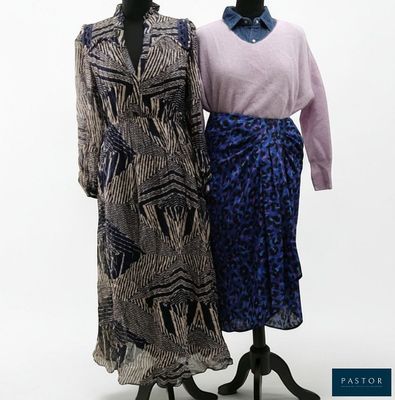 two mannequins are standing next to each other in front of a white background