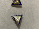 two lapel pins with a triangle and a triangle with a triangle on it