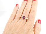 an image of a woman ' s hand with a ring on it