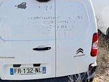a white van that is parked in the grass
