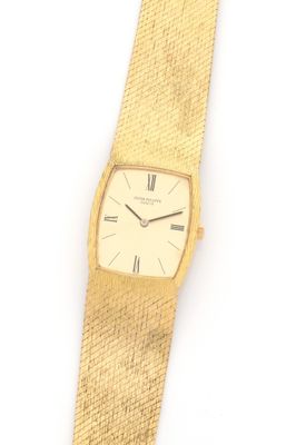an image of a gold wrist watch with roman numerals on it