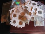 a lot of coins sitting on top of a brown case