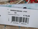 a label on the back of a dress with a price tag attached to it