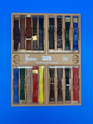 une boîte contenant tout un tas de montres de différentes couleurs
