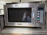 a microwave that is sitting on a table in a kitchen