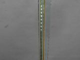 a lamp that is on a stand with a red cord