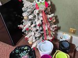 a small christmas tree that has been decorated with decorations