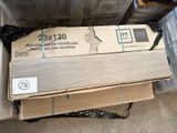 a stack of boxes of wood sitting on the floor