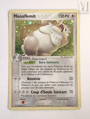 a close up of a pokemon card on a white surface
