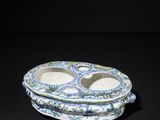 blue and white porcelain plate with two bowls on top of it