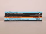 three books stacked on top of each other on a table