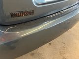 a close up of a car ' s bumper with a number plate on it