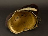 helmet of a soldier with fur on a black background