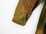 the jacket is green and brown and has buttons on it