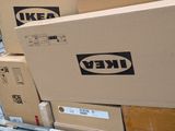 many boxes stacked on top of each other in a warehouse