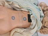 a doll that has a tattoo on it ' s chest