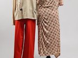 two mannequins are standing next to each other in front of a white background