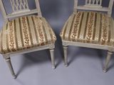 pair of antique chairs with upholstered back and upholstered seat