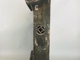 an old wooden clock on a stand with a star on it