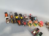 a lot of toy cars and trucks that are on the table