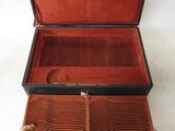 an image of a brown leather case with a pair of glasses in it