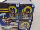 three boxes of harry potter figurines are stacked on top of each other