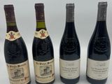 quatre bouteilles de vin sont alignées sur une surface blanche