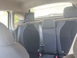 the back seats of a car with a seat belt in a car