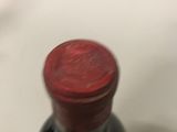 a bottle of wine that is sitting on a table