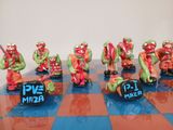 many figurines that are sitting on a chess board