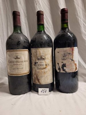 three bottles of wine are lined up on a table