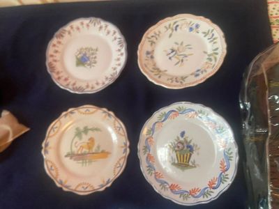 four plates that are sitting on a table