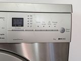 a close up of a washing machine with a digital display