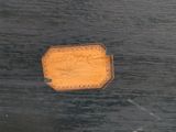 a piece of wood that has a sign on it