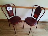 two chairs sitting next to each other on the floor