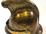 a gold helmet on a white table