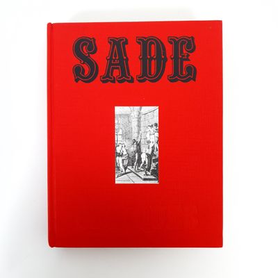 a red book with a picture of a man and a woman on it
