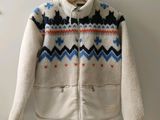 an image of a white jacket with a blue and orange pattern on it