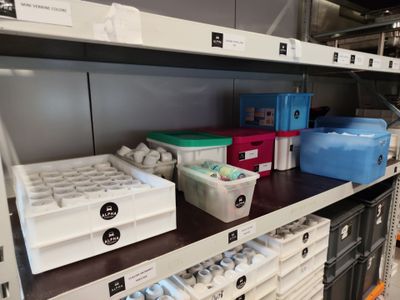many boxes and containers on the shelves in the store