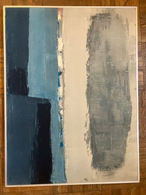 peinture abstraite dans les tons de bleu et de gris sur une surface en bois